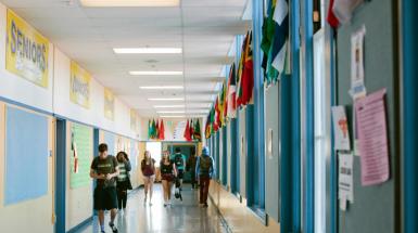 students in empty hallway